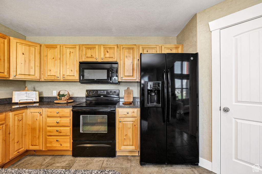 Kitchen featuring black appliances