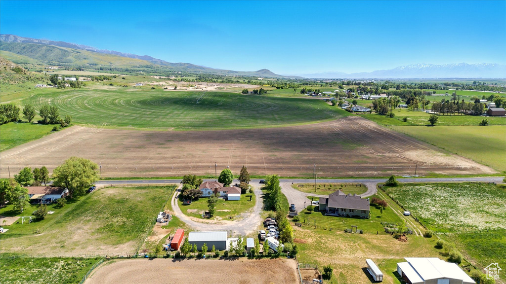 Aerial overview of property\\\'s location with a mountain backdrop and rural landscape