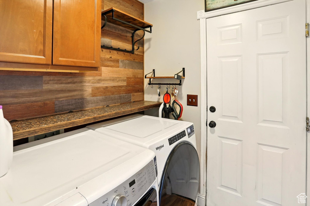 Laundry area with washing machine and clothes dryer and cabinet space