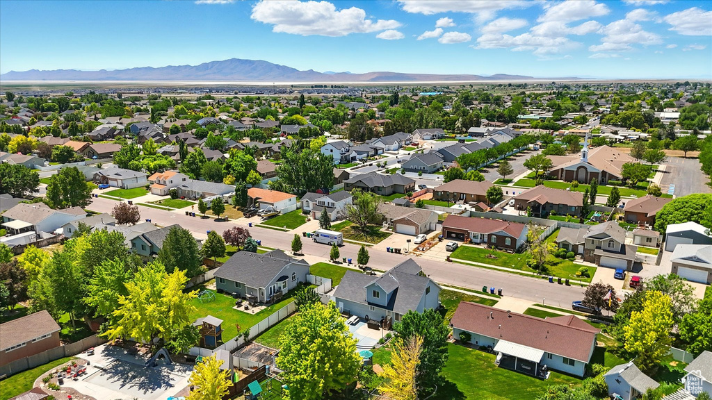 Aerial view of residential area featuring mountains