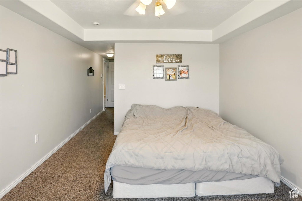 Carpeted bedroom featuring baseboards