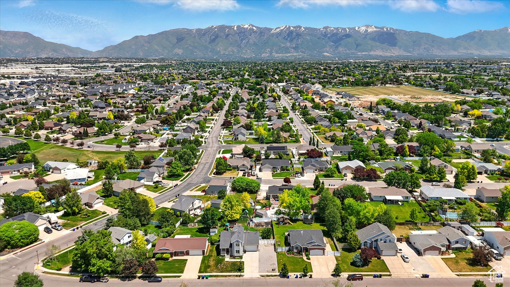 Aerial view of residential area featuring mountains