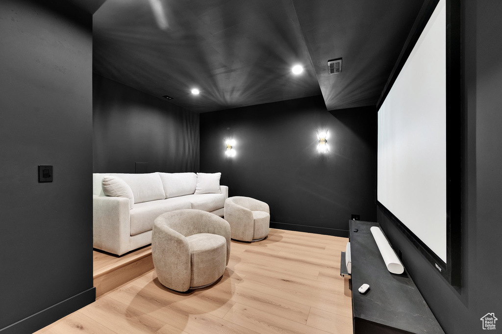 Cinema featuring recessed lighting, wood finished floors, and baseboards