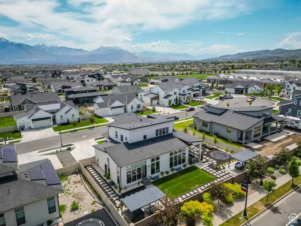 Aerial view of residential area with a mountainous background