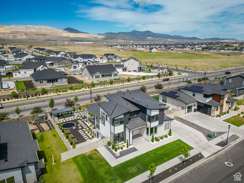 Aerial view of residential area with a mountainous background