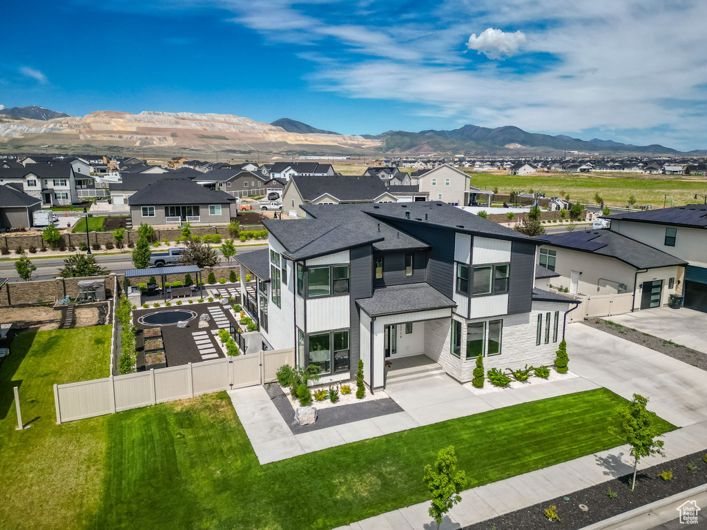 View of front of house with a residential view, a gate, and a mountain view