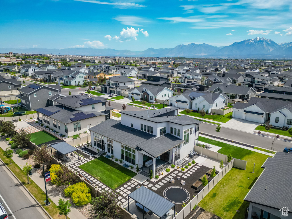 Aerial view of residential area featuring mountains