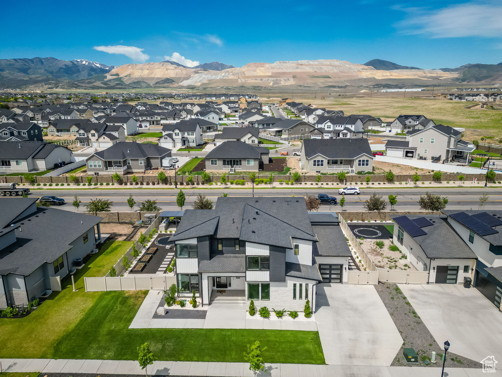 Aerial perspective of suburban area with a mountain backdrop