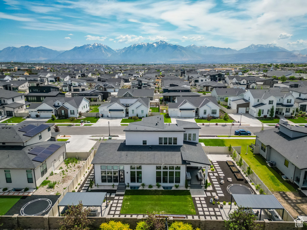 Aerial perspective of suburban area with a mountain backdrop