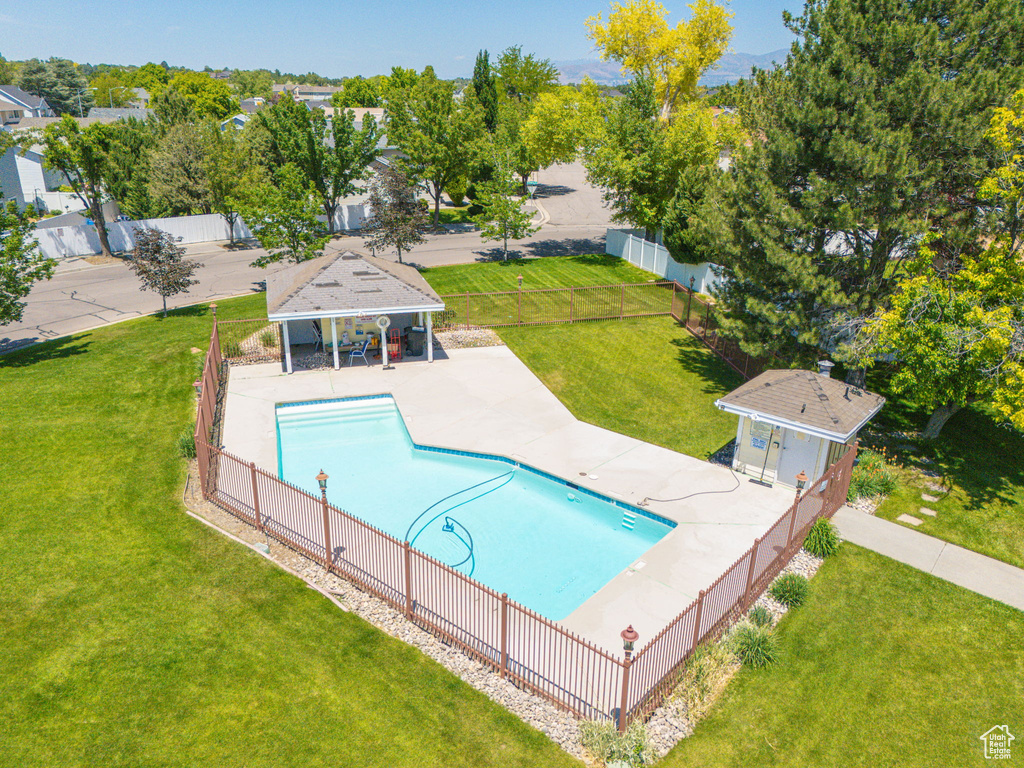 View of swimming pool with an exterior structure, an outbuilding, and a patio area