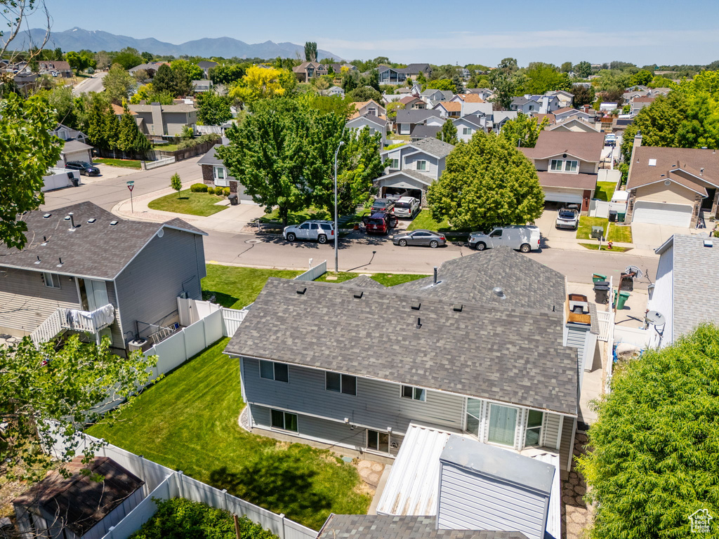 Aerial perspective of suburban area with a mountainous background