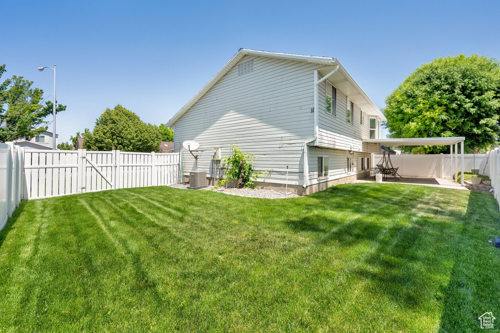 View of property exterior featuring a patio area and central AC