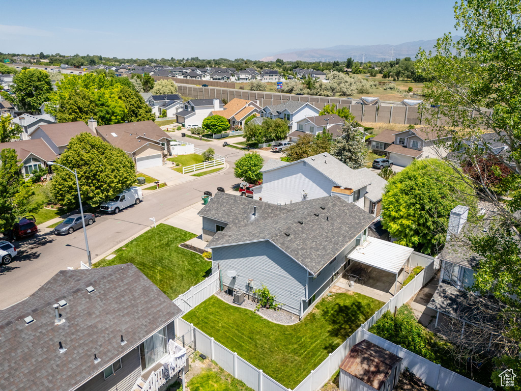 Aerial perspective of suburban area featuring a mountain backdrop