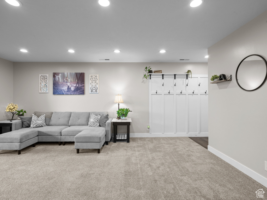 Living area featuring carpet flooring, recessed lighting, and baseboards
