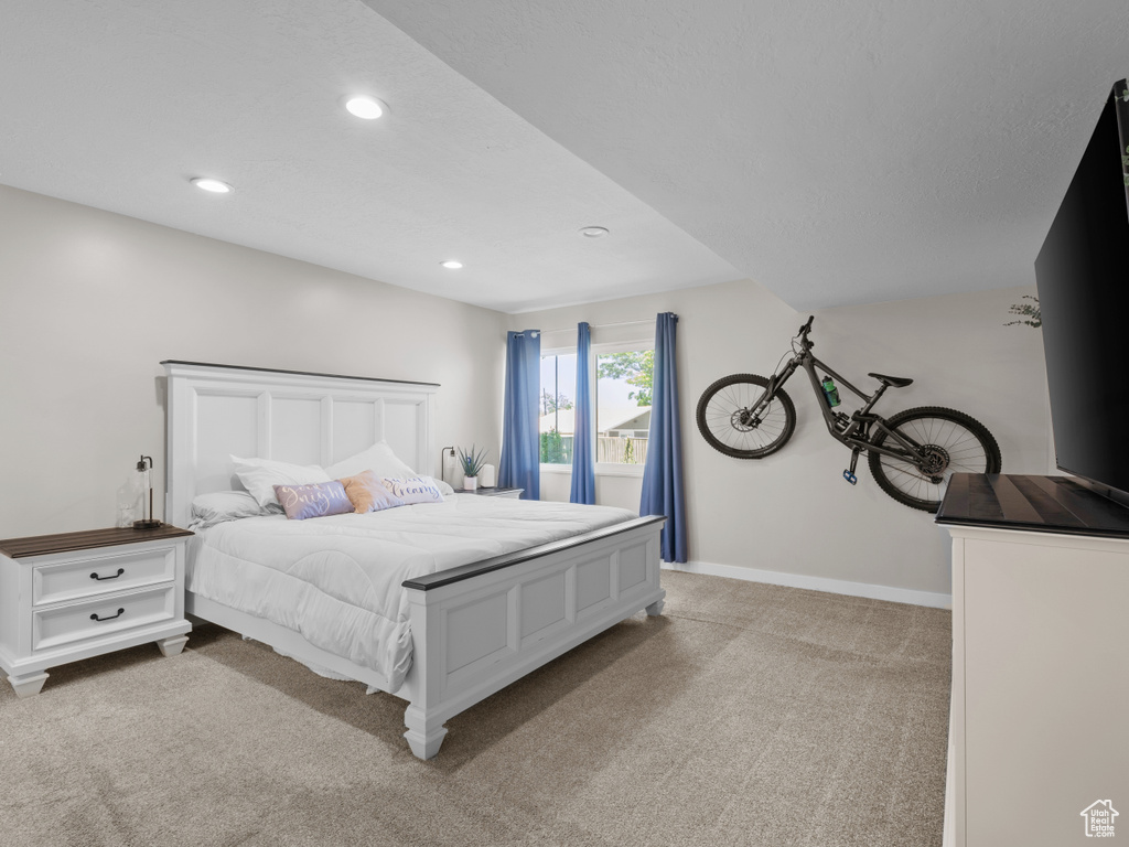Bedroom featuring recessed lighting, carpet flooring, and baseboards