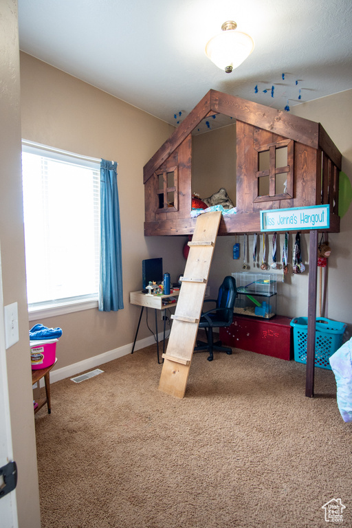 Office space featuring carpet floors and baseboards