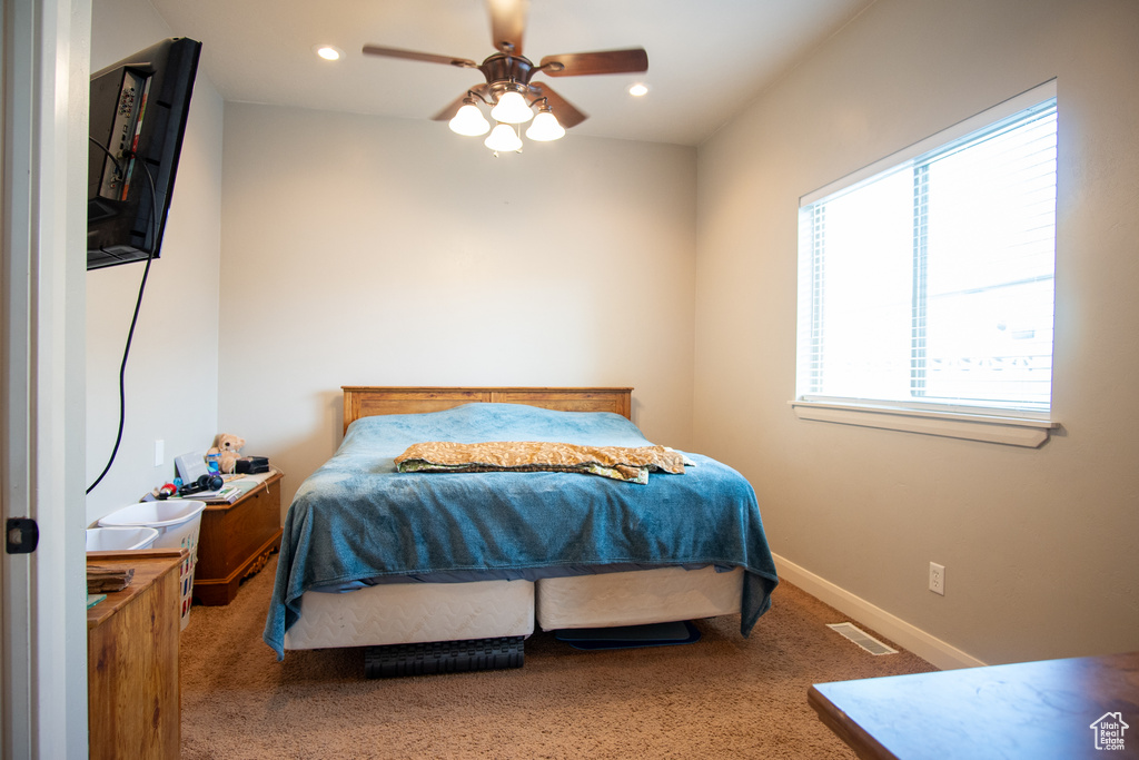 Bedroom with multiple windows, carpet floors, recessed lighting, and ceiling fan