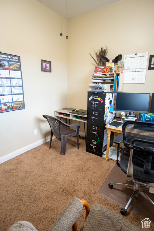 Office space with carpet and baseboards