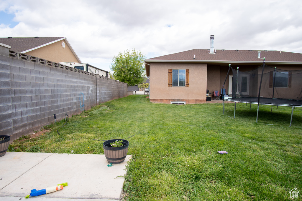 View of yard with a trampoline