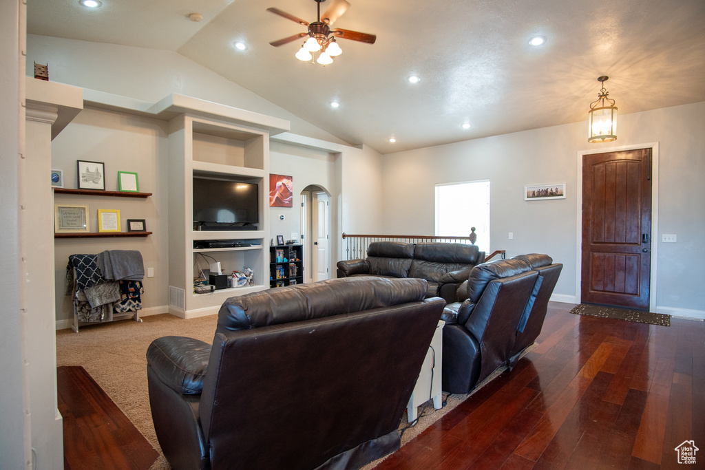 Living area with ceiling fan, arched walkways, lofted ceiling, hardwood / wood-style floors, and recessed lighting