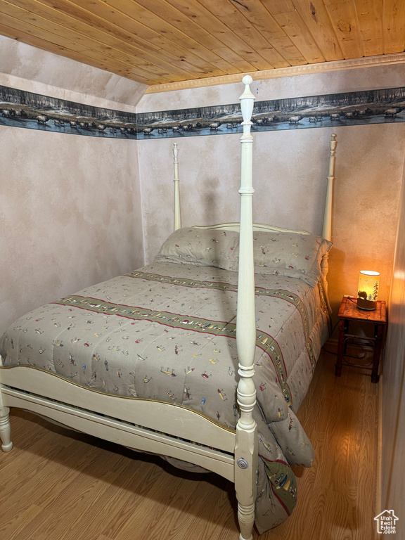 Bedroom featuring wood ceiling and wood finished floors