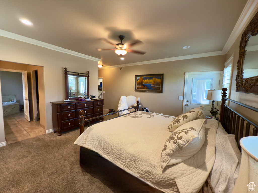 Carpeted bedroom with multiple windows, ornamental molding, a ceiling fan, and recessed lighting