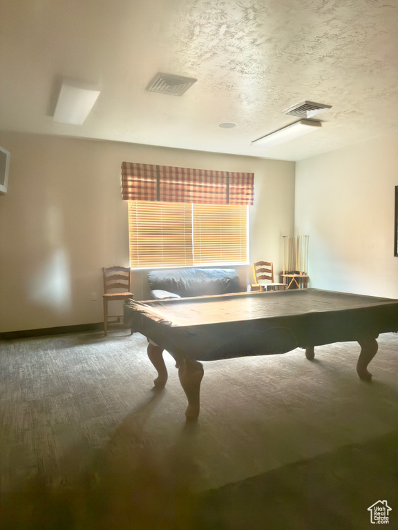 Playroom with billiards table, baseboards, and a textured ceiling