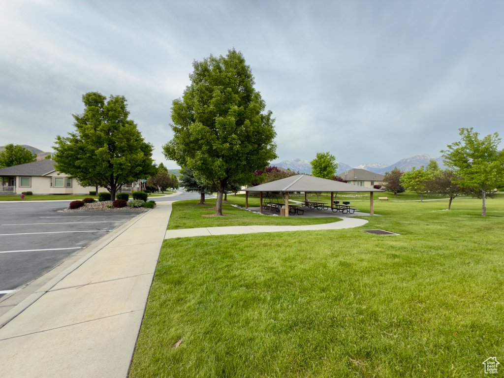 View of grassy yard featuring a gazebo and a mountain view