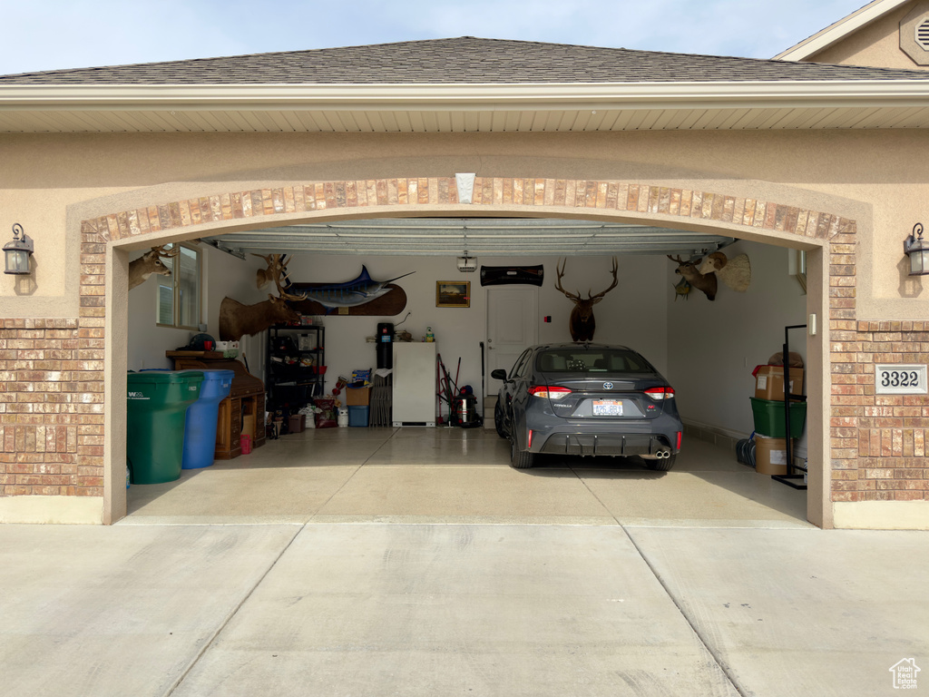Garage featuring driveway