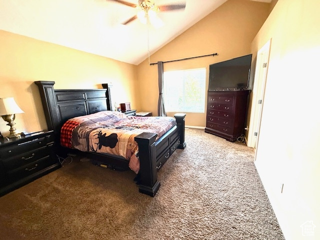 Bedroom with carpet, lofted ceiling, and a ceiling fan