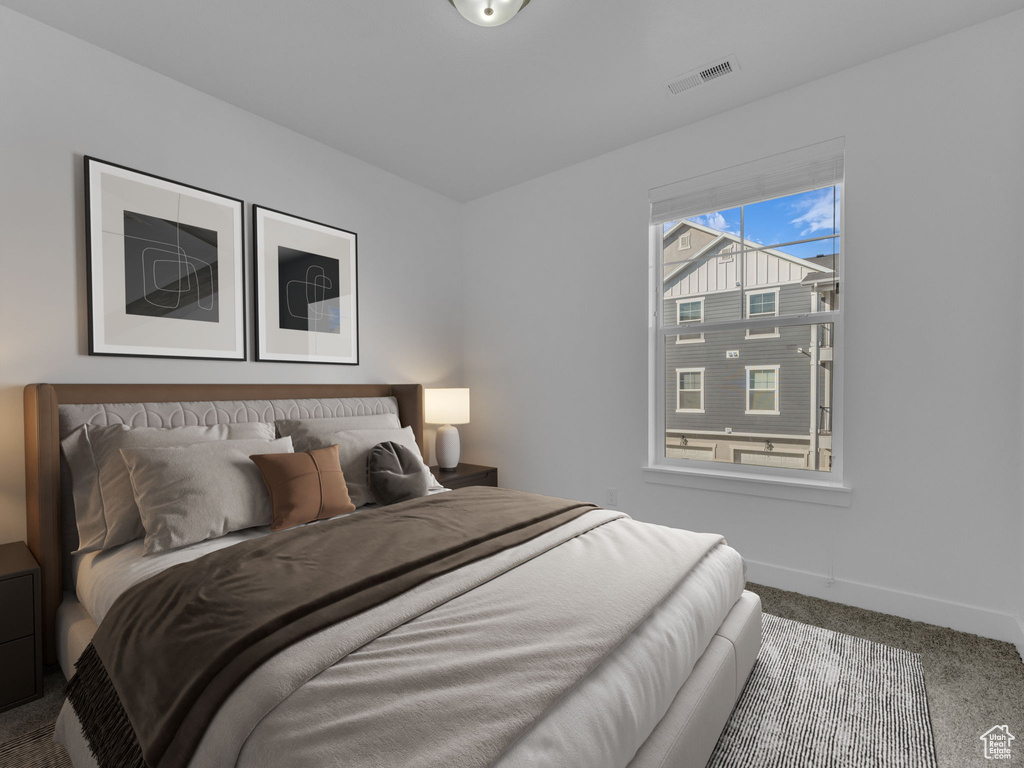 Bedroom with carpet and baseboards