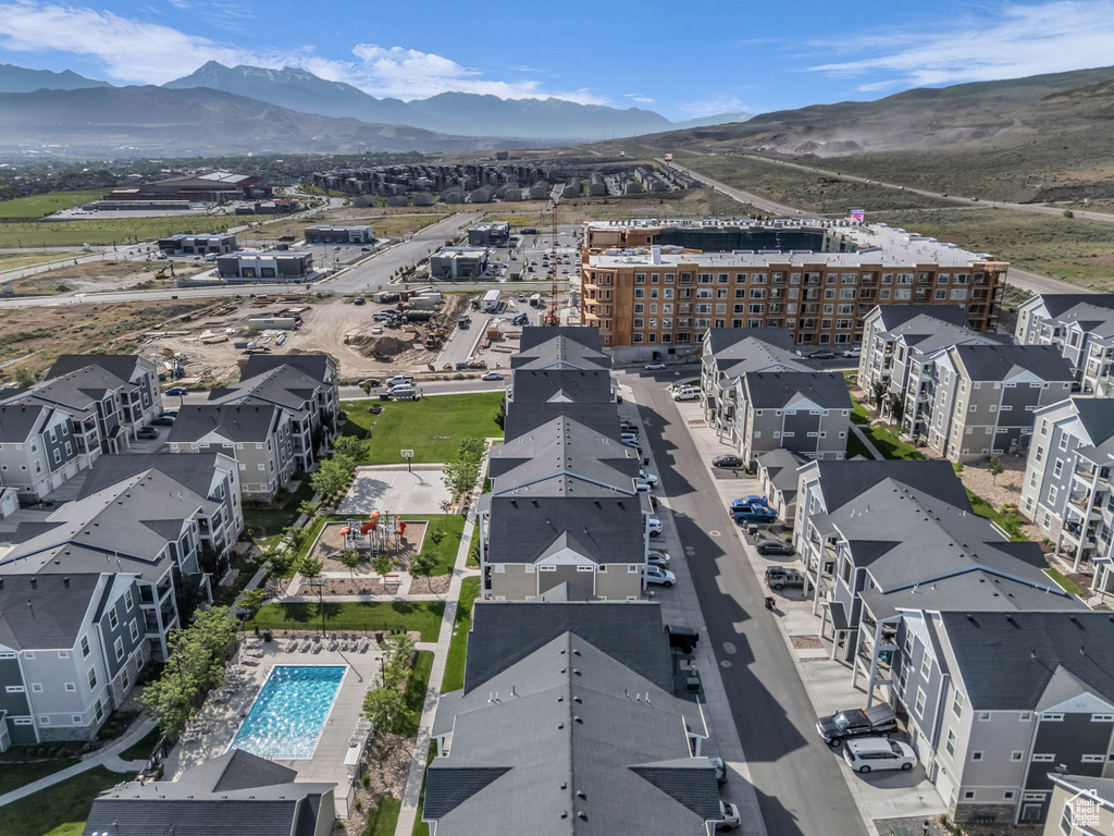 Drone / aerial view of a mountainous background and a pool