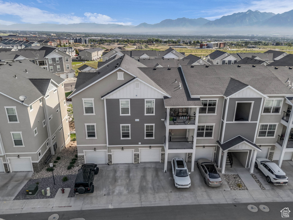 Aerial perspective of suburban area with a mountain backdrop