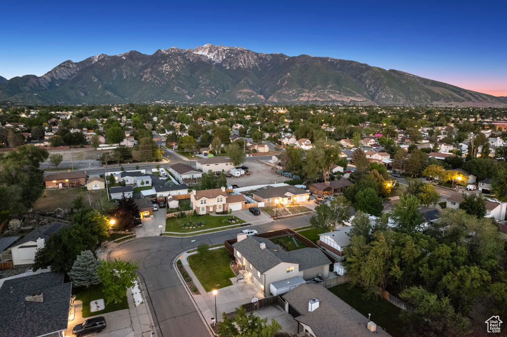 Aerial view of property\'s location with a mountainous background and nearby suburban area