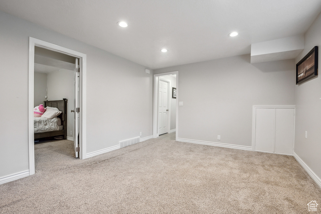 Basement featuring carpet flooring, recessed lighting, and baseboards