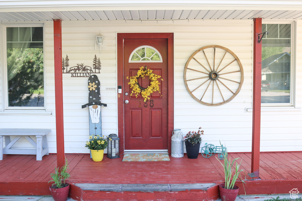 Property entrance with covered porch