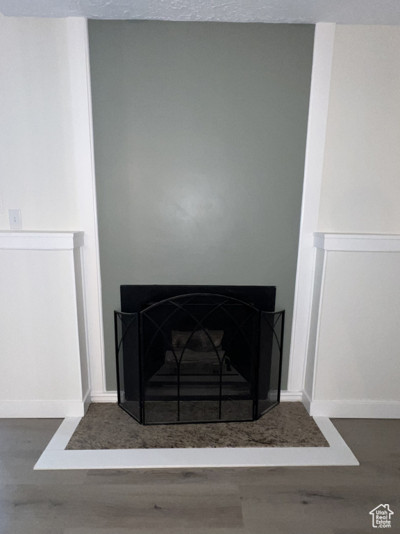Detailed view of wood finished floors and baseboards