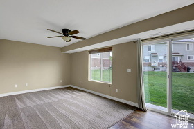Spare room featuring baseboards and a ceiling fan