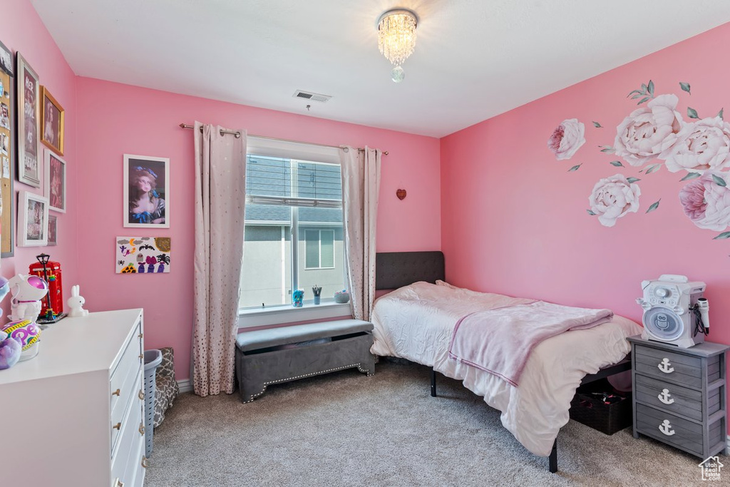 Bedroom with light carpet