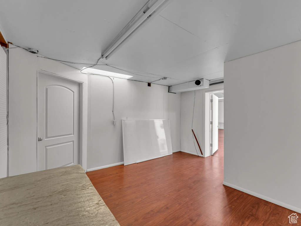 Empty room featuring wood finished floors and baseboards
