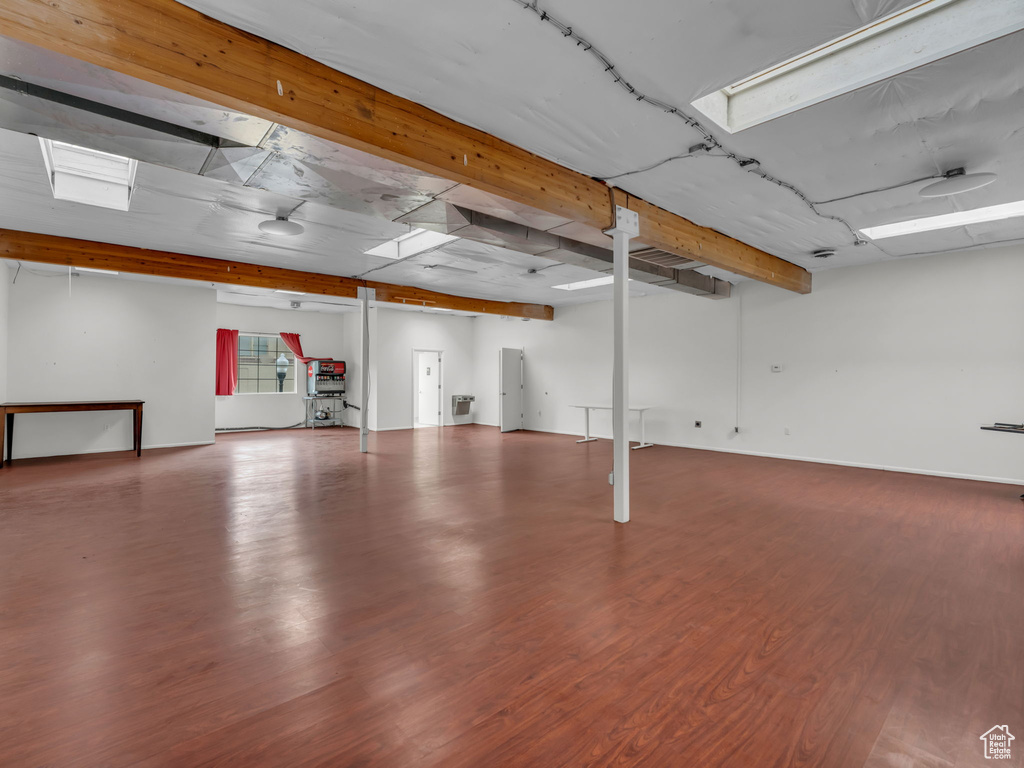 Below grade area featuring wood finished floors