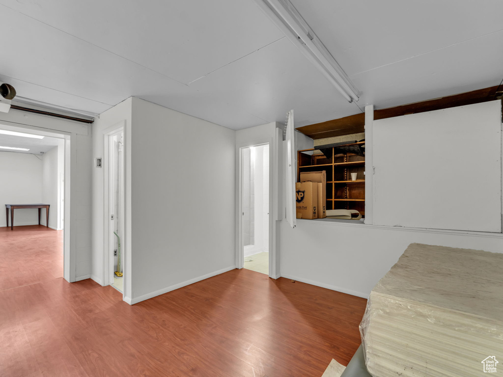 Below grade area with wood finished floors and baseboards