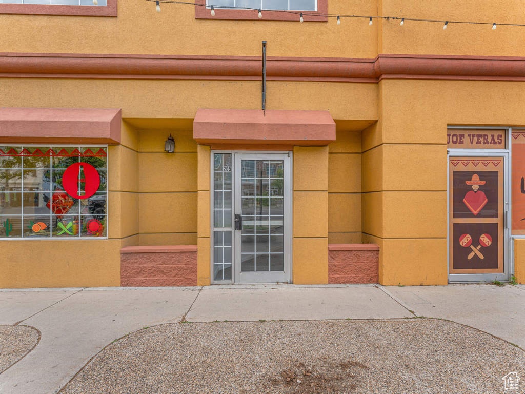 Doorway to property with stucco siding