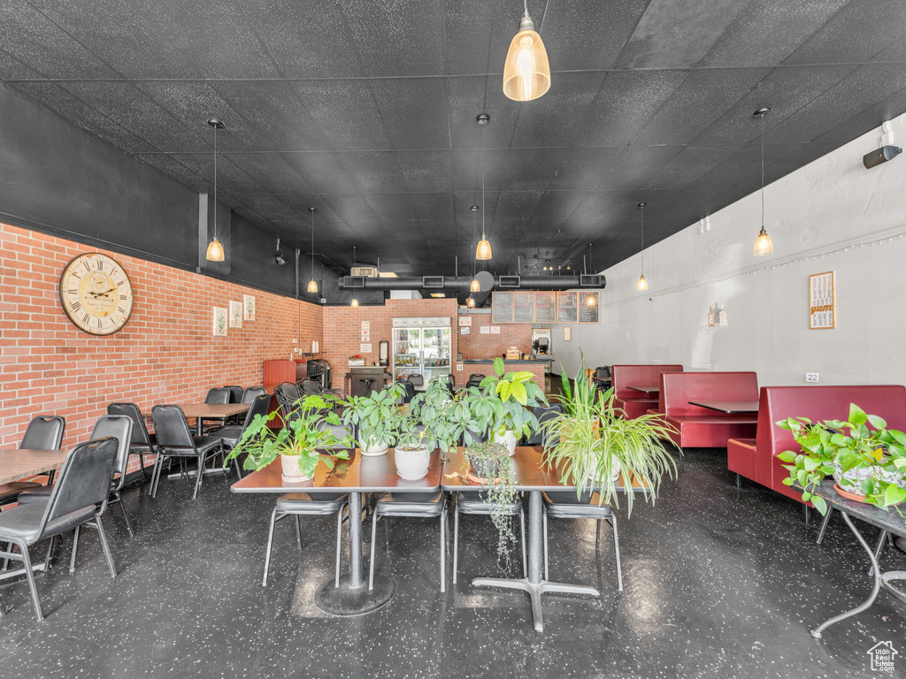 Dining area with brick wall
