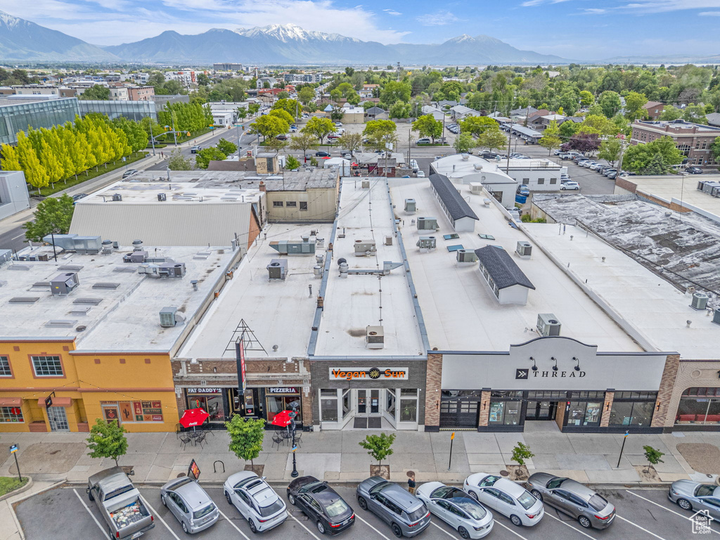 Drone / aerial view of a commercial area and mountains