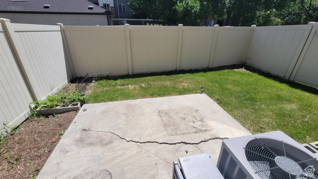 View of yard featuring a patio area and central AC