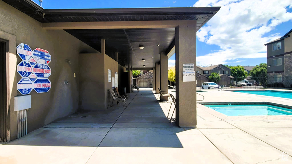 Community pool with a patio area