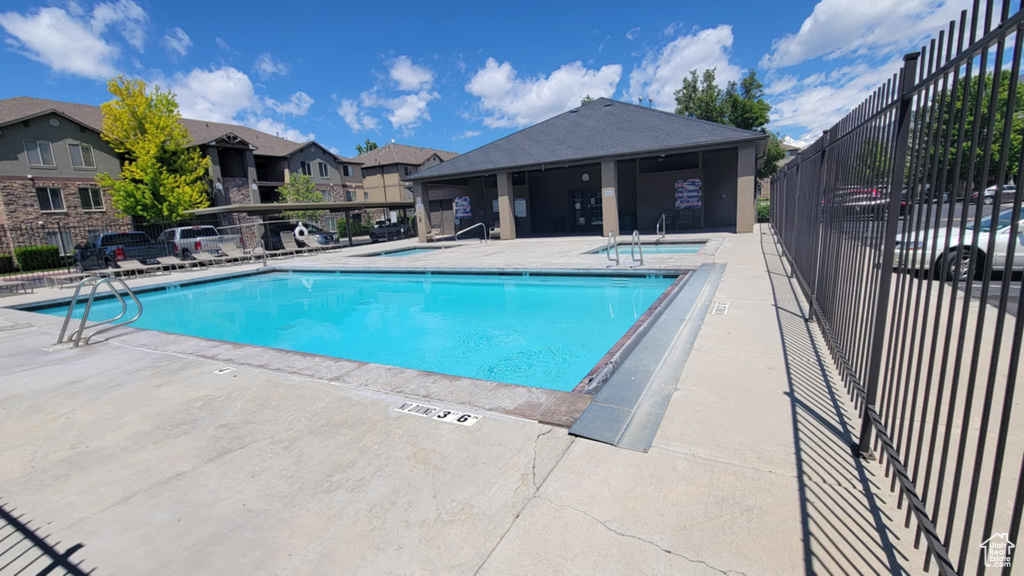 Community pool with a patio area