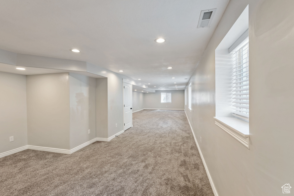 Below grade area with carpet floors, recessed lighting, and baseboards