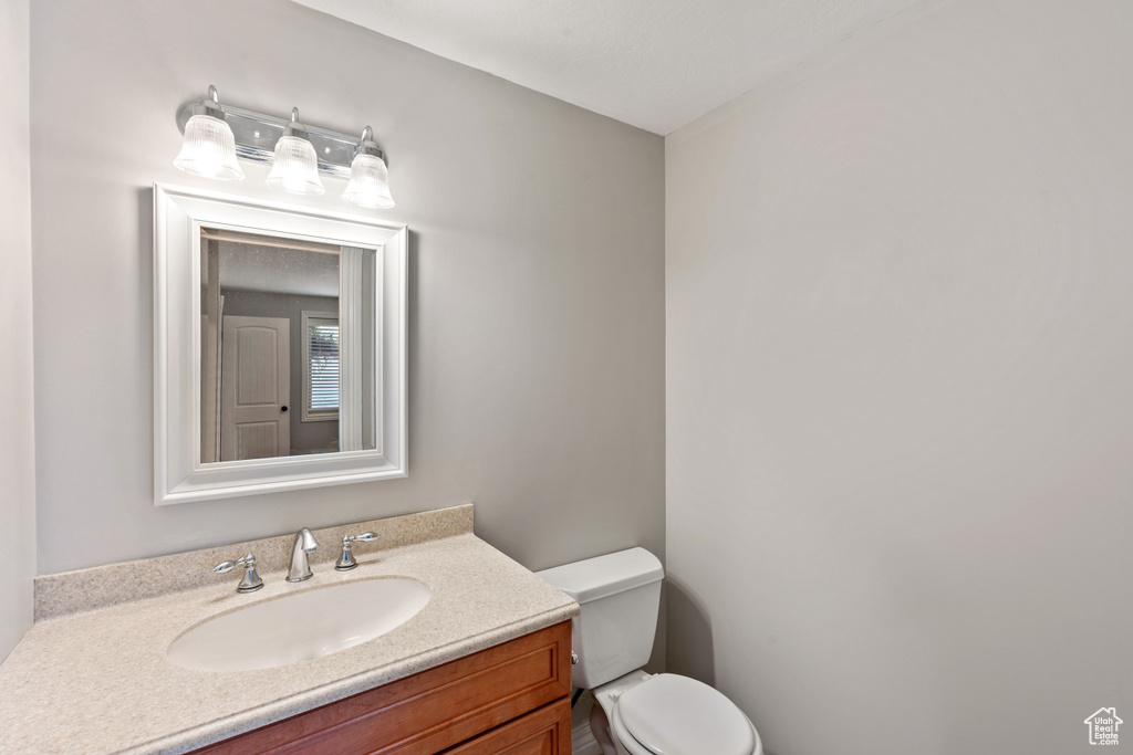 Half bath with toilet and vanity
